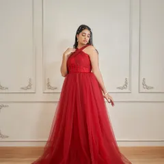 Meet 'Sereina', a stunning red gown with a criss-cross halter neck and a corset-style woven waist. It also comes with detachable sleeves for versatile styling.