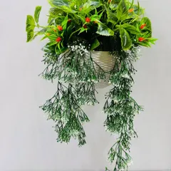 A beautiful artificial hanging basket with lush green leaves, delicate white trailers, and small red flowers.