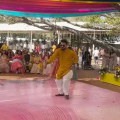 Here I am, taking center stage to get the party started. As your hype man, I love jumping in with a solo performance to get everyone in the mood for a full-power sangeet dance session.