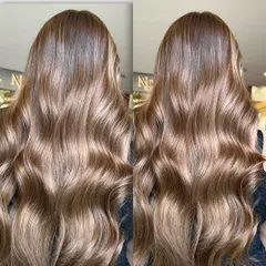 This side-by-side comparison shows the beautiful, cool-toned bronze lowlights in long hair. The color has a gingerbread biscuit feel, perfect for adding a touch of warmth to a cool palette.