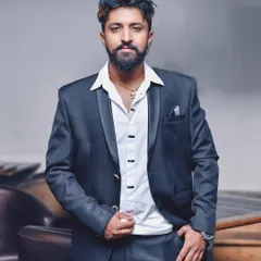 A professional shot in a formal suit. While I'm known for high-energy parties, I always maintain a professional appearance suitable for any corporate environment.
