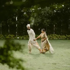 A quiet walk through a lush green lawn. Sometimes the simplest moments, framed by nature, make for the most beautiful and timeless couple portraits.
