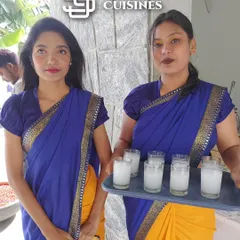We seamlessly blend tradition with professional service. Here, two of our hostesses in beautiful yellow and blue sarees are serving welcome drinks, a perfect choice for traditional ceremonies, engagements, and weddings where cultural attire is preferred.