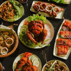 Another view of our party platter, showcasing the variety of dishes I can prepare for your special occasions. The whole fried chicken is always a crowd-pleaser.