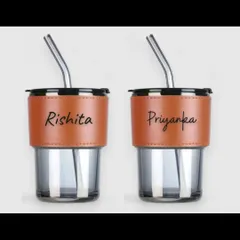 These glass coffee sippers can be personalized with names like 'Rishita' and 'Priyanka'. They are a stylish and personal way to enjoy your favorite beverage.