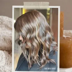 Another angle of this beautiful balayage, showing how the face-framing highlights provide a natural glow. This technique is perfect for adding dimension to medium-length wavy hair.