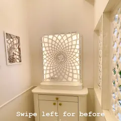 We designed and built this serene, modern pooja unit for a client's home. It features a beautiful backlit jaali panel with an 'Om' symbol and a compact cabinet below for storage, creating a peaceful corner for prayer.