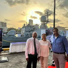 Posing with pride as the sun sets behind an Indian Navy warship. These events are filled with emotion and history, and we are humbled to provide our services for such significant occasions.