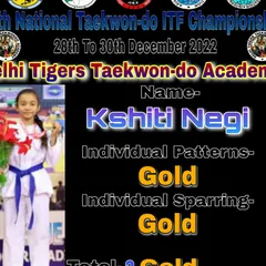 Kshiti Negi showcasing her two Gold medals from the 2022 National Championship. She dominated in both Individual Patterns and Individual Sparring, a result of her focused training.