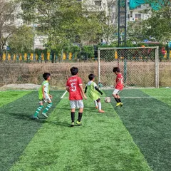 Intense action from a friendly match between our U10 team and Goal Hunters U10. These games are crucial for development and applying skills learned in training.