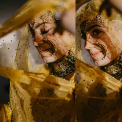 An artistic shot through the yellow veil, with shadows creating a beautiful pattern. Her makeup remains flawless and her smile is captivating.