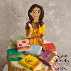 This saree-themed cake is one of my signature designs and never goes out of style. This half-kg Red Velvet cake features a beautiful figurine surrounded by a stash of tiny, hand-painted fondant sarees.