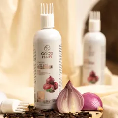 I styled this hair oil to showcase its unique comb applicator and natural ingredients. The soft, draped fabric and wooden slice create an earthy, gentle feel, while the cut onion reinforces the product's core component.