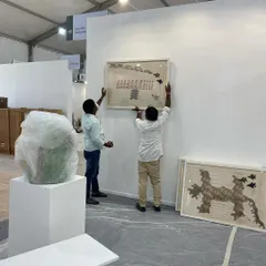 My team installing Archana Hande's large embroidered works for our booth at Art Mumbai. Setting up for an art fair is an intense, coordinated effort.