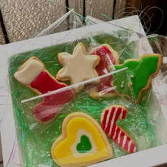 A sweet little gift box of our iced Christmas cookies. This assortment includes a stocking, a star, a candy cane, and a Christmas tree, all individually decorated and ready for gifting.
