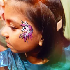 Unicorns are always a favorite. This face painting captures the magic with vibrant colors and glittery details, perfect for a fantasy themed party.