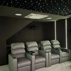 We install premium, ergonomic recliners with built-in cupholders for maximum comfort during long viewing sessions, complemented by a fiber optic star ceiling for a truly magical ambiance.
