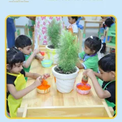 Little artists painting plant pots. This spring-themed activity combines art with nature, teaching children about plants while they express their creativity.