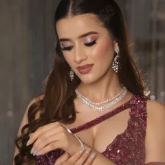 A stunning cocktail glam look. I created soft smokey eyes, dewy skin, and a bold nude lip, paired with sparkling gems for the ultimate evening soirée.