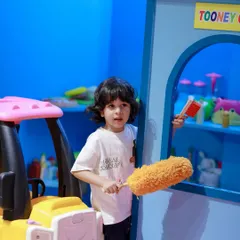Getting the Tooney Cafe ready for the next customer. This little helper is taking their job very seriously with our kid-safe cleaning toys.
