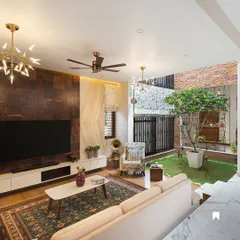 This living room in our Twin Courtyard House directly overlooks the internal green space. The design allows the family to enjoy the feeling of being outdoors while being comfortably inside, perfect for Bangalore's pleasant weather.