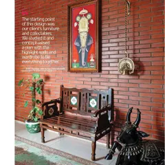 A closer look at the foyer's details. The antique bench, brass temple lamp, and Nandi sculpture were all part of the client's collection, which we used as the starting point for the entire design.
