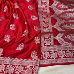 A stunning Rose Motif Mashru Silk Saree in a brilliant red. The silver zari work creates a beautiful contrast against the rich silk fabric.