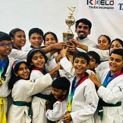 The entire team holding our 2nd place trophy at the 5th Champions Trophy 2023. A collective victory that shows the strength of our academy.