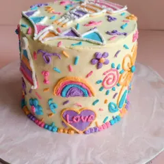 This side of Theo's cake features a rainbow and a heart filled with the word "Love". We can incorporate any theme or design you have in mind.
