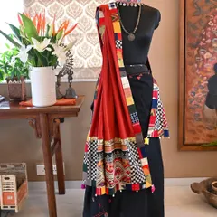 A bespoke wrap that marries the weaving traditions of two distinct cultures. This piece combines a vintage 'Tin Sinh' tribal silk from Laos, featuring a Naga serpent motif, with the earthy texture of hand-woven Kala cotton from Kutch, Gujarat.