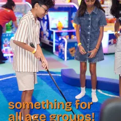 Something for all age groups. Here, older kids enjoy a round of mini-golf, showcasing how our activities are designed to entertain everyone, not just the little ones.