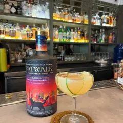 The Light Foot, another of my popular zero-proof creations. It's a refreshing, citrus-forward drink garnished with a cucumber ribbon and a dehydrated lime wheel.