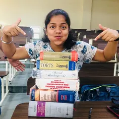 A fun throwback to my law school days. This picture perfectly captures my life back then: surrounded by heavy law books like the Civil Procedure Code and Torts, but always with a smile.