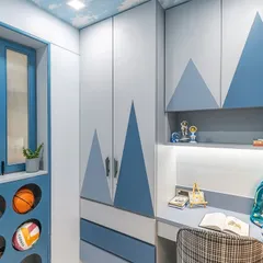 This angle captures the entire functional wall, from the creative sports ball storage on the left to the wardrobe and study nook. Every element is designed to be playful yet practical for a growing child.