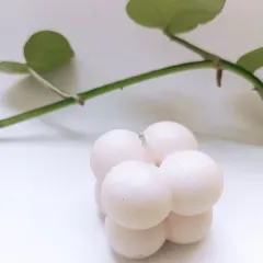 The bubble candle, pictured here with a touch of green, is made from 30 grams of high-quality soy wax. You can message me directly for any color or fragrance customization.