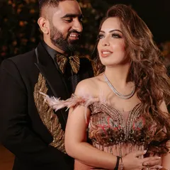A beautiful couple shot from the engagement. Her makeup looks flawless and complements her groom's sharp look.