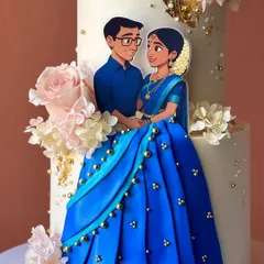 A close-up of the personalized topper, capturing the couple's likeness in a sweet, artistic style.