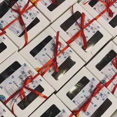 I can prepare bulk orders of party favor boxes, like these brownie boxes with custom labels and ribbons for a birthday party.