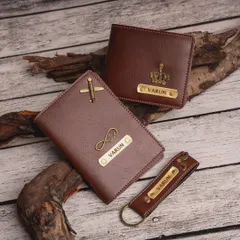Duplicate of 98. This men's daily essentials kit includes a personalized wallet, passport cover, and keychain. You can mix and match charms, like the airplane and crown shown here.