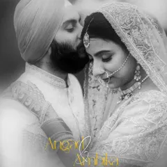A timeless black and white portrait. This classic shot of the groom kissing his bride's forehead is pure romance, an image that will never go out of style.