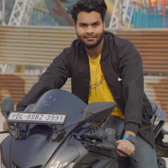A closer shot of the model on the bike. This portrait captures his confident expression and is perfect for a profile picture.