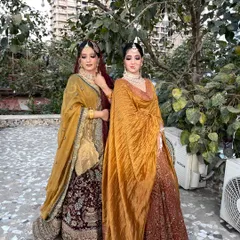 Two stunning sisters, ready for the wedding. I created complementary looks for them that suited their individual styles while maintaining a cohesive, traditional aesthetic.