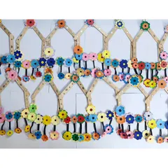 A beautiful wall hanging created by our students using ice cream sticks and colorful foam flowers. We love projects where kids can collaborate and create something stunning together.