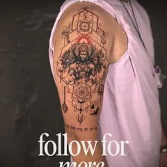 This half-sleeve masterfully blends a realistic portrait of Lord Hanuman with a background of sacred geometry and mandalas. It's a powerful fusion of spiritual portraiture and precise pattern work.