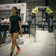 This is what hybrid training is all about. The farmer's carry at a Hyrox event combines pure strength with endurance. It’s a test of physical power and mental grit, a core part of my functional fitness programs.