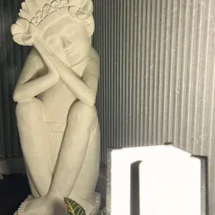 A client's serene evening setup in Bangalore. Our sandstone doll, with its beautiful floral headdress, is artfully lit, creating a peaceful and contemplative atmosphere.