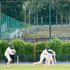 A batsman plays a classic drive during a practice match on our lush green cricket ground. This is where technique is perfected.