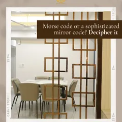 Is it morse code or a sophisticated mirror code? This unique metal partition for a dining area adds a layer of intrigue and artistry, separating spaces without closing them off.