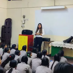 Addressing a classroom of students, sharing my journey and encouraging them to consider the field of law.