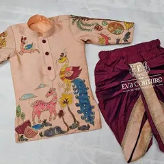 My designs for boys are just as special. This custom Kalamkari kurta features hand-painted nature motifs, paired with a comfortable and stylish maroon dhoti.